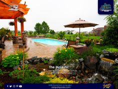 an outdoor pool surrounded by rocks and plants