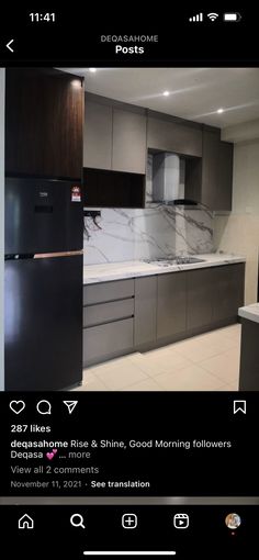 an image of a kitchen with marble counter tops and stainless steel appliances in the middle