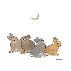 three rabbits sitting next to each other in front of a half moon