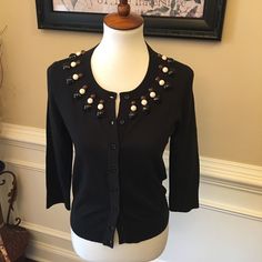 A Tricolor Sweep Of Beading At The Neckline Brings A Bold Jolt Of Glamour To A Demure Cardigan In A Fine-Gauge Cotton Knit. The Cropped, Close-Fitting Style Is Finished With Three-Quarter Sleeves And Ribbed Trim. M = 6-8 21 1/2" Length (Size Medium). Pit To Pit 19 Ins Front Button Closure. 100% Cotton. Dry Clean. 287 Chanel Tote Bag, Chanel Tote, Cotton Knit, Black Cardigan, Quarter Sleeve, Three Quarter Sleeves, Tri Color, Three Quarter, Sweaters & Cardigans