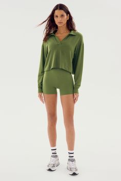 Our favorite fleece sweatshirt updated to a classic rugby polo style. Indulgent and sporty, with raglan sleeves, ribbed cuffs and cropped. The feminine drape stretch modal fabric is soft, versatile and ultra-flattering. MADE IN LOS ANGELES to minimize our carbon footprint. BEST FOR: Warming up and cooling down after running, yoga, CrossFit, barre, Pilates, cycling and spin class. Model Stats:Height: 5’10”, Bust: 32", Waist: 23”, Hips: 34”Wearing size: Small Barre Pilates, Rugby Polo, After Running, Running Yoga, Spin Class, Modal Fabric, Polo Sweatshirt, Warming Up, Polo Style