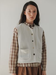 Editor's NotesThis is the 'tig button vest' from Monochrome, a piece that beautifully encapsulates a vintage autumn mood. This vest features a regular fit and a basic silhouette, making it ideal for layering.- Made from jersey fabric, providing durability and a strong structure- The use of various sizes and colors of natural buttons made from wood, nuts, and buffalo horn- Reflecting Monochrome's characteristic styleMeasurements(in.)One Size(XS-M)- Shoulder: 15.94 in.- Chest: 19.88 in.- Hem: 19.69 in.- Length: 20.20 in.* Model Info: Height 5' 84 Top Korean 55Composition & Care- 95% Cotton, 5% Polyester- HAND WASH ONLY (Neutral detergent / In cold water) / DO NOT USE DRYERDesigner- by MONOCHROME Cotton Button-up Vest With Buttons, Button-up Cotton Vest For Fall, Beige Fall Sweater Vest With Pockets, Beige Sweater Vest With Pockets For Fall, Spring Vest With Button Closure For Layering, Classic Fall Vest With Pockets, Classic Fall Vest With Buttons, Everyday Cotton Vest With Button Closure, Classic Winter Vest With Buttons