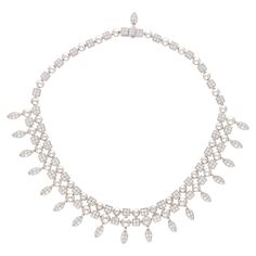 A visually staggering vintage Bvlgari diamond tassel choker necklace set in 18k white gold. From the now discontinued Bvlgari Lucea collection, the piece is composed of a sequence of square pave set diamond panels and white gold pointed beads which together create a fantastic contrast in the choker design. This design echo’s that of the Art Deco style as it also features 17 articulated leaf shaped drops that are also each pave set with diamonds. There is a total of 294 individual diamonds within Bvlgari Diamond Necklace, Bulgari Jewelry Necklaces, Vintage Bvlgari, Expensive Necklaces, Bvlgari Necklace, Choker Design, Bulgari Jewelry, Bvlgari Jewelry, Diamond Choker Necklace