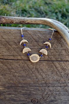 A beautiful moon phase necklace made from elk antler! Show off your love of nature, while still looking classy and fun with some real antler jewelry from NarrowsDesigns. #moonphasenecklace #cowgirljewelry #hippiejewelry #hippienecklace Nature-inspired Round Pendant Jewelry With Moon Charm, Deer Antler Jewelry, Deer Antlers Necklace, Deer Antler Crafts, Hippie Accessories, Red Choker, Antler Earrings, Antler Crafts, Antler Jewelry