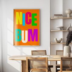 a dining room table with chairs and a poster on the wall above it that says nice bum