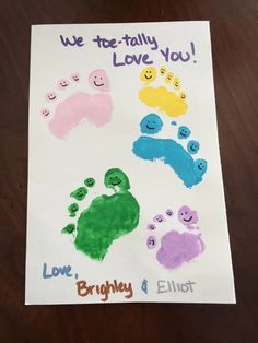 a child's hand and foot print with the words we too - totally love you