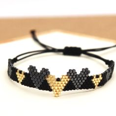 Hearts Miyuki Seed Bead Adjustable.Bracelet Gold And Black Boutique Item Offers Welcome Bundle And Save! Dm For More Info :-) Gold Beaded Bracelets With Heart Beads For Party, Gold Party Beaded Bracelets With Heart Beads, Heart-shaped Friendship Bracelet With Tiny Beads, Friendship Heart Bracelet With Tiny Beads, Adjustable Bracelet With Heart Charm For Party, Adjustable Black Heart Bracelet, Adjustable Party Bracelet With Heart Charm, Adjustable Heart Bracelet With Tiny Beads, Adjustable Black Friendship Bracelets For Party