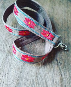 "Unique fabric lanyard. This colorful key holder makes a beautiful accessory. Made with handwoven Guatemalan textile that uses the back strap loom technique. The bright, colorful pattern makes your keys easy to spot. Never lose your keys again! They make great gifts for teacher appreciation too! Woven on a tan base with a simple red floral pattern. My items are handmade by me, I do not resell Guatemalan items that is mass produced in Guatemala. The patterns and designs on our woven textile is un Adjustable Brown Lanyard As Gift, Bohemian Handmade Lanyards As Gifts, Bohemian Adjustable Lanyards For Everyday Use, Handmade Adjustable Lanyard For Everyday Use, Handmade Adjustable Lanyards For Everyday Use, Minimalist Fabric, Lanyard Id Holder, Lanyard Teacher, Guatemalan Textiles