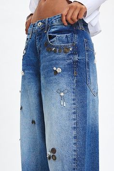 The ultimate pair of effortless boyfriend jeans from BDG updated with embellishments. Super relaxed and baggy fit throughout with a low-rise and a wide-leg silhouette. Made using recycled materials and finished with a BDG logo at the back pocket. Find it exclusively at Urban Outfitters. Features BDG Jaya embellished baggy boyfriend jeans Extreme baggy jeans Crafted from rigid BDG denim with embellishments Low rise that sits at the hip Full length with a puddled hem Zip fly; 5-pocket styling UO e Baggy Boyfriend Jeans, Jean Crafts, Elevated Basics, Boyfriend Jean, Baggy Jeans, Baggy Fits, Exclusive Collection, Recycled Materials, Boyfriend Jeans