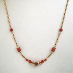 Red Love Necklace necklaces LUNARITY GARAGE Red Carnelian Round Bead Jewelry, Elegant Jewelry With Box Chain And Round Beads, Elegant Ruby Necklace With Polished Beads, Elegant Gold Beaded Necklaces For Valentine's Day, Gold Ruby Round Bead Necklaces, Elegant Red Necklace With Clavicle Chain, Red Dainty Jewelry For Formal Occasions, Dainty Red Jewelry For Formal Occasions, Elegant Red Clavicle Chain Necklace