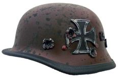 an old helmet with metal decorations on it