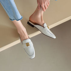 Handmade from premium leather. these loafer mules are really comfortable and breathable. Boasting metallic decoration. these flat beige mules help you show an easy chic look.These leather mules are also versatile enough for work or some other formal occassions. Upper: Genuine Leather Lining: Genuine Leather Outsole: Rubber Toe: Round Toe Closure: Slip on Color: Green. Beige is_handmade: Yes Spring Office Slip-on Mules, Spring Slip-on Flats With Metal Feet, Luxury Summer Loafers With Flat Heel, Trendy Flat Mules For Office, Elegant Summer Clogs With Flat Heel, Elegant Flat Heel Clogs For Summer, Luxury Summer Loafers, Summer Slip-on Office Loafers, Chic Beige Slip-on Mules