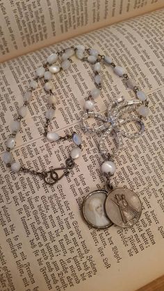 Upcycled Vintage Mother of Pearl Rosary Religious Assemblage | Etsy Vintage Rhinestone Necklace For Gift, Antique Rhinestone Necklace For Gift, Antique Rhinestone Necklace Gift, Vintage Rhinestone Jewelry For Gifts, Vintage Beaded Medallion Jewelry, Vintage Rhinestone Pendant Jewelry, Vintage Pendant Necklace With Rhinestones, Vintage Rhinestone Pendant Necklace, Vintage White Jewelry For Memorial