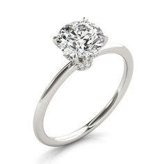 a white gold engagement ring with an oval cut diamond