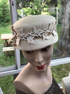 "Vintage 1950s 1960s Light Beige straw hat. Has fabric appliqués of leaves surrounding the crown. Also a Velvet ribbon. The label reads: Imported Braid. CONDITION: I note a tiny spot on one of the appliqués on the right side (SEE PIX). MEASURES: Inside circumference-22\" Crown height-3\" Left to right-7 1/2\" Front to back-8\" **WE APOLOGIZE~BUT WE CAN NO LONGER SHIP TO ITALY OR SPAIN. WE HAVE INCURRED TOO MANY ISSUES WITH SHIPPING. PACKAGES GOING MISSING..DAMAGED...ETC. IF ORDERS COME IN FROM I Vintage Cream Hat For Vintage Events, Cream Vintage Hat For Vintage Events, Vintage Straw Cap For The Beach, Vintage Straw Cap For Beach, Vintage Beige Hats For Vintage Events, Beige Vintage Hats For Vintage Events, Vintage Curved Brim Straw Hat For Church, Vintage Brimmed Straw Hat For Church, Vintage Straw Hat With Short Brim For Church