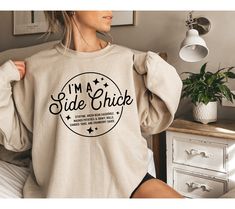 I'm a Side Chick Sweatshirt, Funny Thanksgiving Sweatshirt, Turkey Fall Sweatshirt, Thanksgiving Dinner Sweatshirt, Chick Sweatshirt WARNING -READ BEFORE ORDERING- REMEMBER: - The design is a Direct-to-Film (DTF) print. -You may refer to the size chart for precise measurements as all our sizes are unisex. There may be differences in sizes among brands. -Feel free to contact us if you have any issues about the things (sizes, shirt colors, design text colors, etc.). -Please be aware that we use di Chick Shirt, Side Chick, Thanksgiving Sweatshirt, Turkey Shirts, Design Text, Halloween 2023, Dtf Print, Funny Thanksgiving, Fall Shirt