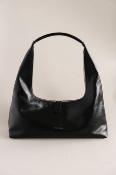 MARGESHERWOOD Large hobo bag in glossy black leather. H4.25" x W10" x D2.5". Total height 12". MW241-BG22-BKGP PIPE AND ROW Classic Black Bag With Glossy Finish, Classic Black Bags With Glossy Finish, Black Glossy Business Bag, Black Glossy Travel Bags, Black Glossy Finish Shopping Bag, Sleek Black Glossy Shoulder Bag, Black Leather Shoulder Bag With Glossy Finish, Classic Leather Bag With Glossy Finish, Modern Black Hobo Bag With Smooth Grain