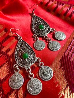 "Brand new dangling earrings from Kyrgyzstan. Traditional Central Asian design . Have a taste of ancient Silk Road in your collection.  Brand new dangling earrings in traditional design from Central Asia (Kyrgyzstan, Kazakhstan, Uzbekistan) Perfect & unique addition to your collection or ideal for gift. Length: 3\" Wide: 1.5\" Stone in green color. Treat yourself or someone you love with outstanding ancient Silk Road design. Very light & we ship worldwide." Green Traditional Chandelier Earrings As Gift, Traditional Green Chandelier Earrings As Gift, Traditional Green Chandelier Earrings For Gift, Bohemian Metal Danglers As Gift, Bohemian Metal Danglers As A Gift, Vintage Chandelier Earrings For Festivals, Ornate Metal Danglers As Gift, Traditional Nickel-free Teardrop Chandelier Earrings, Traditional Nickel-free Metal Chandelier Earrings