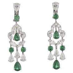 GRAFF EMERALD AND DIAMOND EARRINGS. STONES: circular-cut and pear-shaped emeralds of approximately 4.38 carats total, circular and marquise-cut and pear-shaped diamonds of approximately 6.10 carats total SIGNATURE: Graff MARKS: no. GE14932 SIZE/DIMENSIONS: 5.3 cm GROSS WEIGHT: 8.4 grams Graff Earrings, Graff Jewelry, Emerald And Diamond Earrings, Earrings Stones, Graff Diamonds, White Gold Diamond Bracelet, Emerald Diamond Earrings, Diamond Chandelier Earrings, Diamond Chandelier