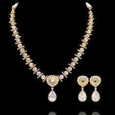 Elevate your style with this exquisite jewelry set that's bound to make every moment unforgettable! Introducing a dazzling jewelry set - a stunning ensemble that radiates timeless beauty and elegance as it is adorned with meticulously crafted CZ stones, capturing the perfect balance of sophistication and glamour, making it the ideal accessory for any special occasion. The set includes a necklace and a pair of matching earrings. Approximate earrings length is 1.7". Gold-plated on high-quality bra Dazzling Crystal Jewelry Set With Stone Setting, Elegant Festive Jewelry Sets With Diamond Accents, Elegant Gold-plated Bridal Sets For Wedding, Elegant Bridal Cubic Zirconia Necklace For Festive Occasion, Elegant Gold Plated Bridal Sets For Wedding, Elegant Gold Plated Bridal Sets For Anniversary, Elegant Festive Bridal Necklace With Cubic Zirconia, Dazzling Jewelry Sets With Elegant Design, Elegant Festive Jewelry Sets With Sparkling Stones