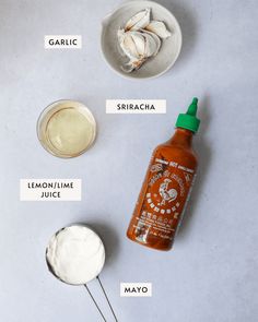 ingredients to make homemade mayonnaise for chicken wings on a white counter top with spoons