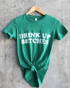 a green t - shirt with the words wish you were beer on it hanging on a hanger