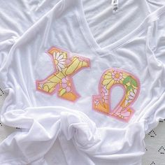 a white t - shirt with the letter k on it