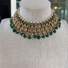 This gorgeous Emerald Necklace set is made from fine polki stones. Comes as a set with earrings and a head piece. ALL SALES ARE FINAL ON JEWELRY. KINDLY MESSAGE ME FOR ANY INQUIRIES. Kundan Chandbali Necklace With Jewels, Chandbali Kundan Necklace With Jewels, Bollywood Chandbali Jeweled Necklaces, Bollywood Style Jeweled Chandbali Necklaces, Bollywood Style Jeweled Necklaces, Bollywood Style Jeweled Festive Necklaces, Bollywood Style Kundan Necklace With Jewels, Bollywood Style Festive Necklace With Jewels, Bollywood Style Festive Jeweled Necklaces