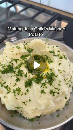 mashed potatoes with parsley in a pan on the stove