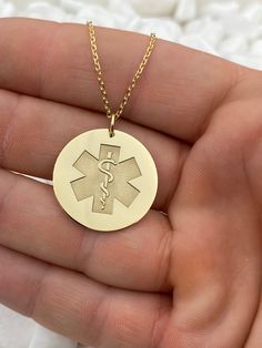 "14k Solid Gold Medical Alert Necklace, Personalized Medical Alert Pendant, Custom Medical ID Pendant, Medical Jewelry 14k Solid Gold Choose What Size You Want the Pendant Using The Second Option Box Photos Are For The 1 inch Diameter Pendant -Pendant thickness : 0.7mm -Inner diameter of jump ring : 5mm -Chain's width: 1.3 mm ♥ Material of pendant and chain: Solid Gold k14 ♥ Packaging: All of our jewelry are beautifully boxed and ready for gifting For more personalized designs take a look here: ♥ www.etsy.com/listing/736955132 ♥ www.etsy.com/listing/819494857 ♥ www.etsy.com/listing/823397880 ♥ www.etsy.com/listing/769847320 ♥ www.etsy.com/listing/872949017 ♥ You can send us via email a name, a letter, or a design of your choice and we will make it for you in solid gold k14. Everything is m Medical Alert Jewelry, Medical Alert Necklace, Medical Jewelry, Packing Guide, Second Option, Medical Alert, Necklace Personalized, Personalized Jewelry, Solid Gold