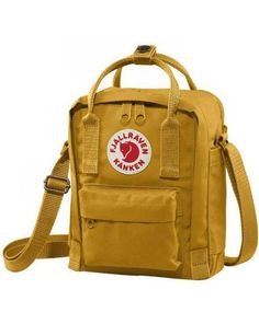 This crossbody sling is perfect for the Kanken lover who is looking for a more compact bag to carry their essentials. 8" x 6" adjustable straps front pocket 100% vinyl Sling Bag Fjallraven, Fjallraven Kanken Mini Bag, Fjallraven Kanken Mini Green, Fjallraven Ochre, Kanken Sling, Mini Cooler, Fjällräven Kånken, Sequin Backpack, Compact Bag