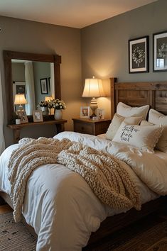 a bed with white blankets and pillows in a bedroom