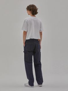 These are trendy workwear-inspired carpenter denim pants from Cork denim collaboration collection. It's cut for long and wide fit from comfortable stretch denim.- Zip and button fastening- Two front slash pockets- Four back pockets- Hammer loop- Logo leather patch at back- Wide fit Relaxed Fit Dark Wash Cargo Pants With Five Pockets, Relaxed Fit Cargo Jeans For Workwear With Belt Loops, Urban Dark Wash Relaxed Fit Cargo Pants, Workwear Dark Wash Cargo Jeans, Dark Wash Cargo Jeans For Work, Urban Style Relaxed Fit Cargo Pants For Workwear, Relaxed Fit Jeans For Work With Standard Cut Leg, Denim Blue Jeans With Side Pockets For Work, Everyday Cotton Cargo Jeans With Belt Loops