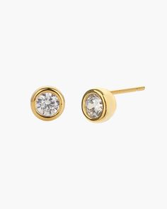 Elevate your style with the Margot Stud Earring, featuring a sparkling, circular accent encased in a round gold frame. This elegant stud design offers a sophisticated touch, perfect for enhancing any outfit with a classic yet contemporary flair. 18k gold over sterling silver Cubic Zirconia Our gold covering on silver is a thick layer of 18k solid gold on sterling silver meaning it will last longer. You get the look and feel of gold jewelry at a fraction of the price. Classic Tarnish Resistant Round Cut Earrings, Classic Gold Diamond Earrings, Tarnish Resistant, Classic Gold Plated Round Diamond Earrings, Timeless Gold Halo Earrings, Formal Gold Bezel Set Earrings, Gold-plated Brilliant Cut Round Earrings, Timeless Gold Earrings With Bezel Setting, Gold Earrings With Bezel Setting Timeless Style, Gold Earrings With Bezel Setting In Timeless Style