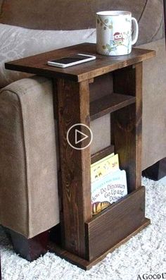 a small wooden table with a book shelf on it and a coffee cup sitting on top