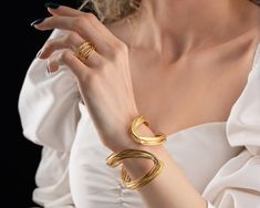 Intricately wowen with gold-plated brass wires, this chunky gold Statement Ring and Cuff Bracelet Set is a guaranteed show-stopper! Designed to impress and make a grand statement! ★ The term 'Adjustable Bracelet' is not for naught, these solid gold rings and bangle bracelets are designed to be able to comfortably fit all body types! You just need to apply slight pressure on either of these chunky wire gold rings or the extra-large bracelets in order to adjust them for your needs. They fit US fin Gold Open Ring Bracelets As Gift, Gold Open Ring Bracelets For Gifts, Gold Open Ring Bracelet As Gift, Gold Open Ring Bracelet For Wedding, Yellow Gold Open Ring Bracelets As Gift, Yellow Gold Open Ring Bracelet For Gift, Yellow Gold Open Ring Bracelet As Gift, Elegant Open Ring Bracelets As Gift, Gift Metal Open Ring Bracelets