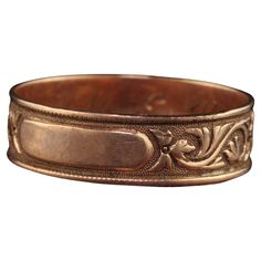 Beautiful Antique Art Deco 14K Rose Gold Floral Engraved Wedding Band - Size 6 1/4. This gorgeous wedding band is crafted in 12k rose gold. The band has deep engravings going around the entire band with a spot that can be engraved with initials. The inside of the band is engraved "M. E. L.". The ring is in great condition and has a gorgeous dark patina on the rose gold that makes it very striking. Item #R1681 Metal: 12K Rose Gold Weight: 1.5 Grams Size: 6 1/4 Measurements: Top of the ring measur Engraved Wedding Band, Gorgeous Wedding Bands, Engraved Wedding, Antique Art Deco, Gold Floral, Antique Rings, Cool Suits, Antique Art, Gorgeous Wedding