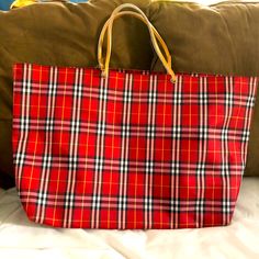 Very Gently Used Red Plaid Burberry Tote Bag With Tons Of Room, Lined Inside. Measures: 14.5” Long, 21.5” Across And 6” Wide. There Are Some Small White Spots And Some Slight Scuffing On The Bottom Of The Bag. Please See Photos Before Ordering. Trendy Red Bag With Large Capacity, Trendy Large Capacity Red Bag, Red Tote Shopping Bag, Red Satchel Shopping Bag, Red Tote Shoulder Bag For Shopping, Red Tote Bag For Shopping, Red Large Capacity Tote Bag, Red Satchel Bag For Shopping, Large Capacity Red Tote Bag