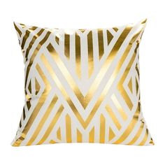 a gold and white pillow with an arrow pattern on the front, sitting against a white background