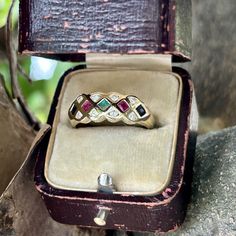 ring box not included** 14k yellow gold gemstones: diamond, ruby, emerald & sapphire diamonds: 0.16 total carat weight, clarity range of SI2-I2, and color range H-J weight: 2.0 grams dimensions: height 20 mm, width 20 mm, depth 6 mm Note: stamped 14k Size 7 Can be sized by a reputable jeweler. We are new to Etsy, but our home store in Evansville, IN has been in business since 1898. We are a 5th generation family-owned business and have certificates in diamond grading from the GIA (Gemological In Vintage Harlequin, Harlequin Pattern, Ruby Emerald, Red Band, Cute Packaging, Home Store, Sapphire Diamond, Stackable Rings, Ring Box