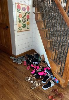 a bunch of shoes that are sitting on the floor