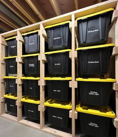 several bins are lined up against the wall