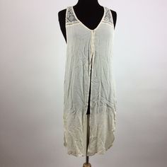 Features: Material: 100% Rayon Specifics: Lace Top W/ Buttons On Front Sleeves: Sleeveless Color: Ivory Sku: 0145n Beige Tank Top For Daywear, Bohemian Tank Top For Spring Daywear, Bohemian Spring Tank Top For Daywear, Spring Bohemian Tank Top For Daywear, Spring Beige Buttoned Tank Top, Beige Buttoned Tank Top For Spring, Beige Sleeveless Tank Top For Daywear, Beige Button Tank Top For Spring, Cream Tank Top For Summer Daywear