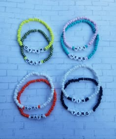 four bracelets with words on them that say, other than the word's name