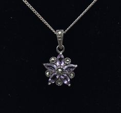 Beautiful vintage sterling silver pendant in a floral form, set with marquise cut amethyst and accented with round cut marcasite stones, on a sterling silver chain necklace.  Pendant - 7/8 x 1/2" - 1.9g - Marked "NF 925" Chain - 19 1/4 inches long - 1.8g - Marked "925" Floral Pendant, Sterling Silver Chain Necklace, Floral Vintage, Marquise Cut, Silver Chain Necklace, Last Minute Gifts, Sterling Silver Chain, Sterling Silber, Vintage Sterling Silver