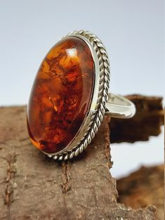 Amber Silver Ring Amber Ring,Orange Cabochon Oval Ring Sterling Silver Ring,Amber Semi Precious Stone Ring,Engagement Ring,Best Seller Amber Ring Why To Wear Silver As a metal, silver has significant health benefits that have been used across cultures for centuries. Silver has a proven track record as a powerful antimicrobial agent fighting infections and aiding in cold and flu prevention, wound healing, and more. Silver also helps with internal heat regulation and circulation. Why To Wear Amber Classic Orange Rings With Polished Finish, Classic Oval Brown Ring, Classic Brown Oval Ring, Formal Orange Oval Rings, Formal Orange Oval Cabochon Ring, Formal Orange Cabochon Ring, Classic Orange Ring Jewelry, Orange Rings With Polished Finish For Anniversary, Oval Orange Cabochon Jewelry