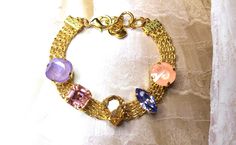 Gorgeous, one of a kind. Colors of rose, lavender, pink, topaz. Can be worn with anything. Casual and dressy. Different shapes make it unique and high end. Fits 6.5 to 8 in. wrist with adjustable extension. Unique Bridal Jewelry, Rose Lavender, Lavender Pink, Wedding Jewelry Bracelets, Pink Topaz, Crystal Bracelet, Austrian Crystal, Wedding Bracelet, Crystal Bracelets