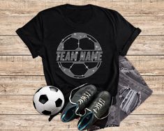 a t - shirt with the words team name on it next to two pairs of shoes