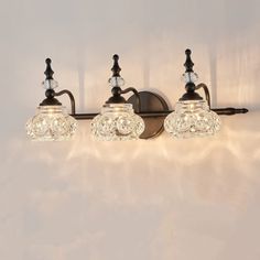 three light bathroom fixture with glass shades