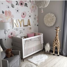 a baby's room decorated in pink and gray